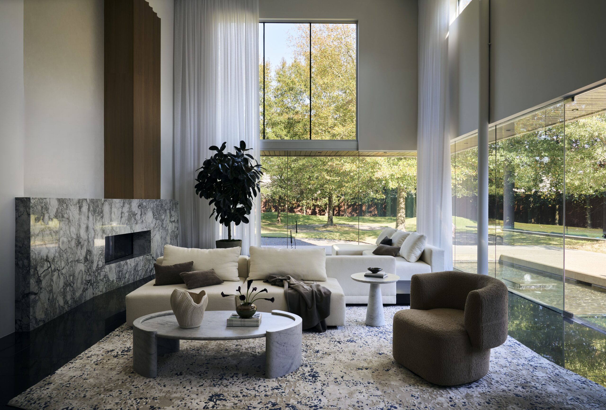 Pine Wood Estates by Nina Magon | A refined modern residence in Houston’s Memorial neighborhood blending architectural stone, bespoke furnishings, and curated contemporary art.