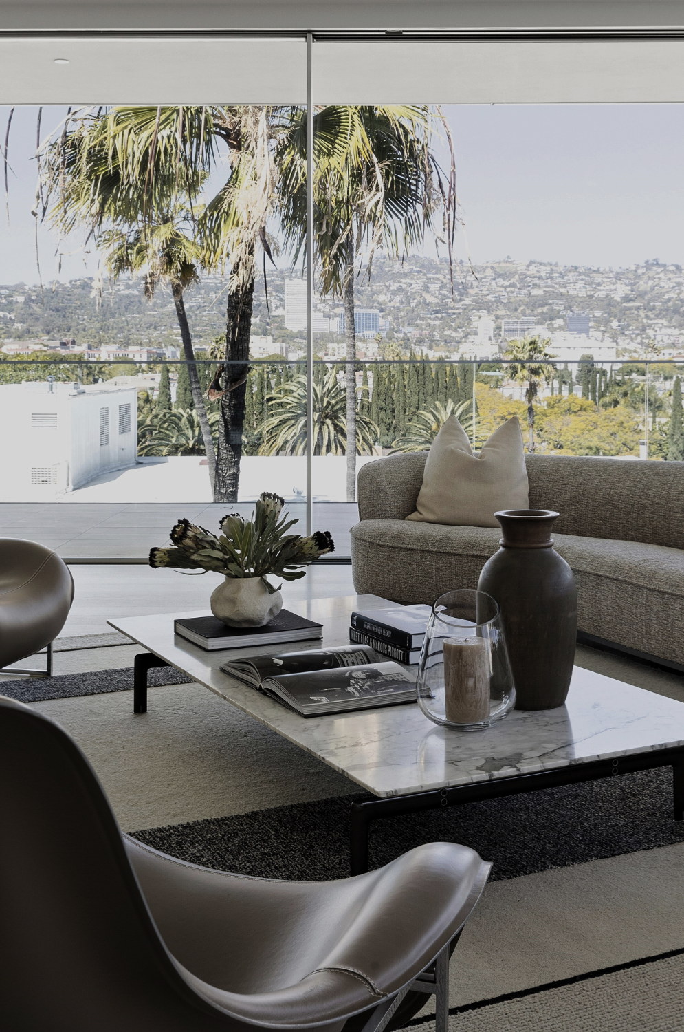 Mandarin Oriental Beverly Hills interior by Nina Magon Studio with marble coffee table and skyline view.