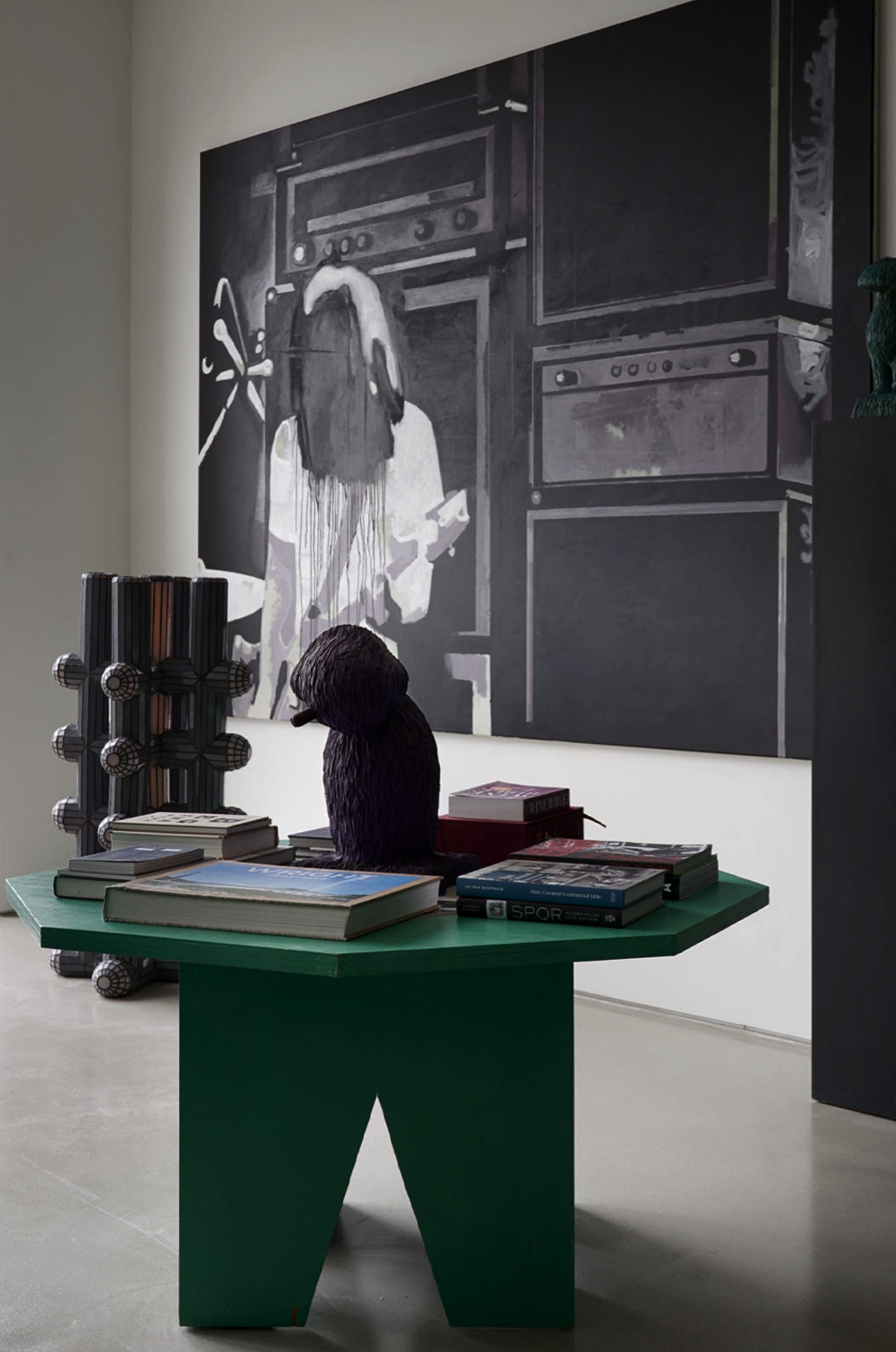 Pacific Heights residence by Nina Magon Studio featuring a sculptural green console table styled with curated art books and objects beneath a large monochrome statement artwork.