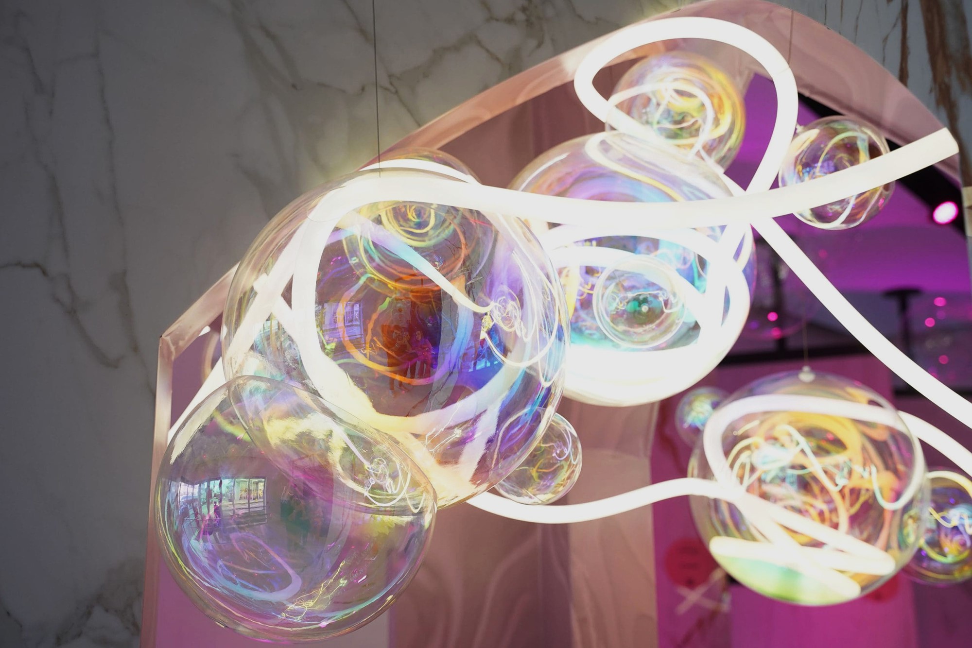 DreamCloud at Design Miami designed by Nina Magon Studio, an immersive light installation with iridescent forms and mist.