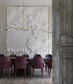 Interior conception by Nina Magon Studio featuring custom floral wall installation, curated furnishings, and refined craftsmanship